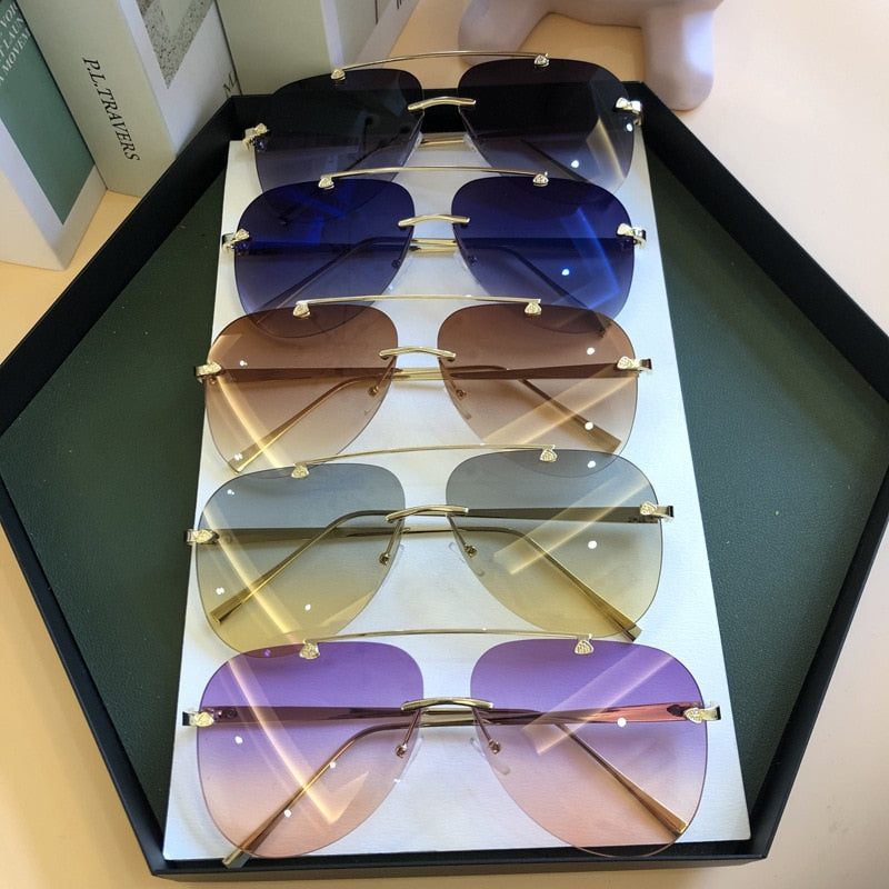 2022  Luxury  Designer Fashion Oval Rimless SunglassesSummer Glasses Fashion Sun glasses For Men Women UV400 Sunglasses